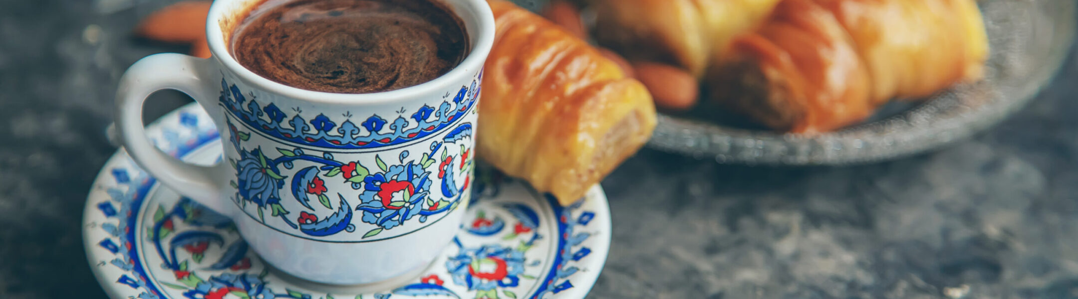 A cup of Turkish coffee and baklava. Selective focus.